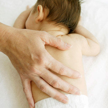 hand on back of sleeping baby