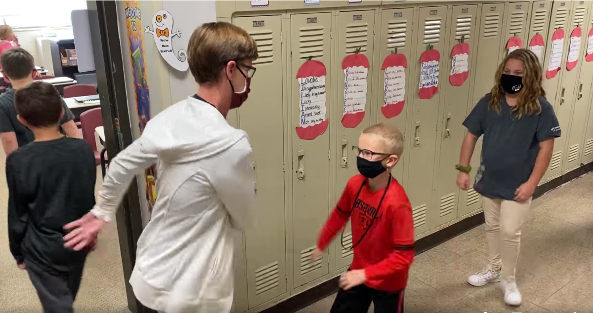 Teacher Makes Personalized Social Distance Greetings to Promote Interaction with Students