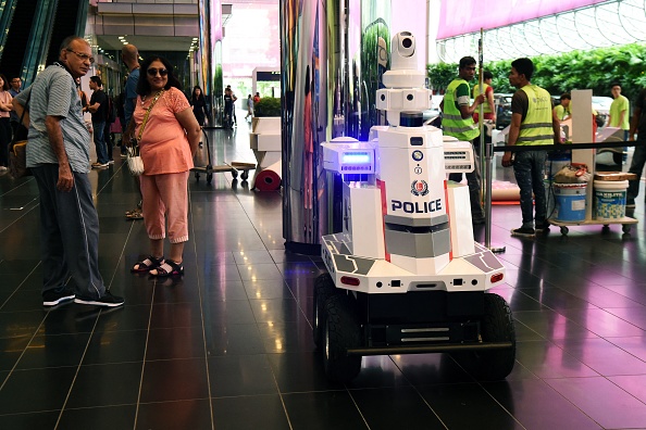 Sci-Fi Reality: Singapore Airport Deploys Police Robots on Patrol, Resembling a Scene from 'Black Mirror