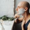 man shaving cream with shaver