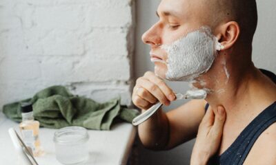 man shaving cream with shaver