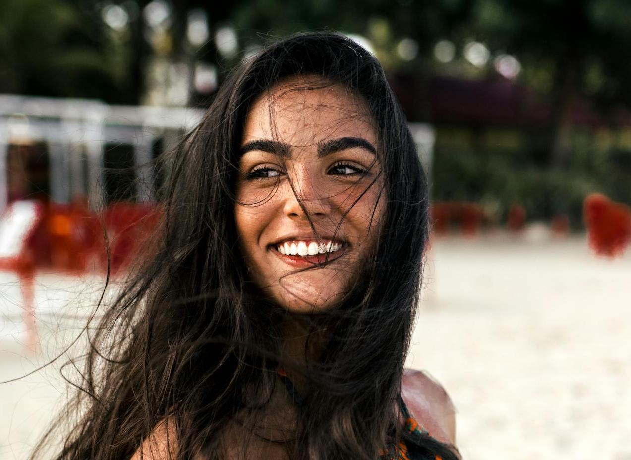 tan girl with beautiful smile