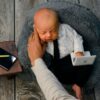 Newborn Photo Shoot Goes Viral After Photographer Shares Photos of Baby's Grumpy Expression Online